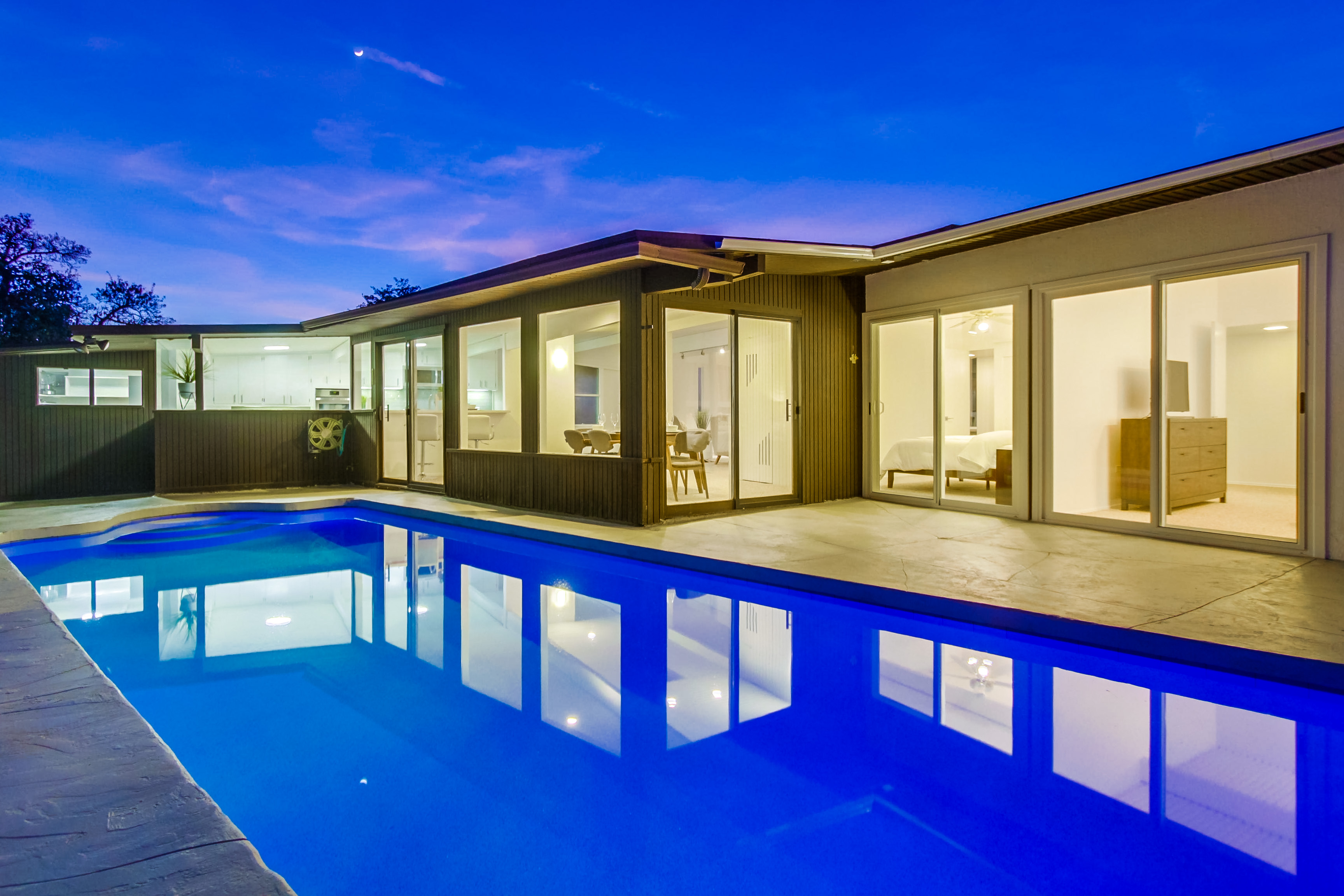 Beautiful vacation rental exterior with pool at twilight